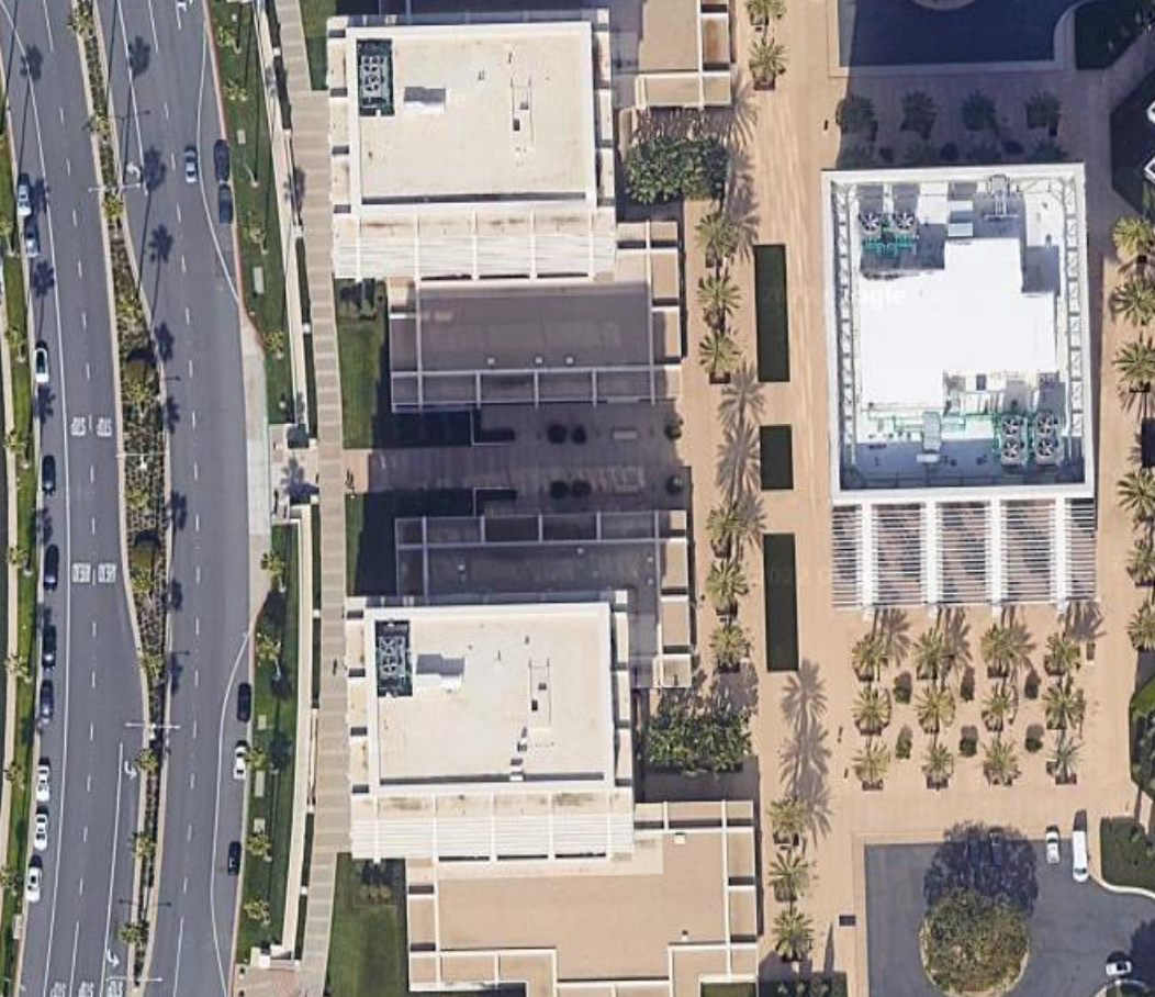 A Google Maps image of 520 Newport Center Drive, Newport Beach, California, including the building, the street in front of the building and the sidewalk between them.
